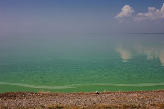 Turquoise olive green sea with the coulds , abstract sea nature background. Happy vacation summer sea concept. Summer holidays.