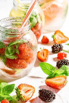 detox smoothies of fresh fruits and vegetables in glass jars with tubes. studio light, light background, space for text