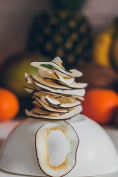 Dried homemade healthy fresh dehydrated slices of fruits. Fruit chips, natural raw vegan organic snack. Healthy food concept.