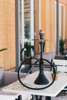 Hookah details for smoking and leisure in natural light.