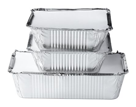 Packed foil food boxes on white background, copy space, close up
