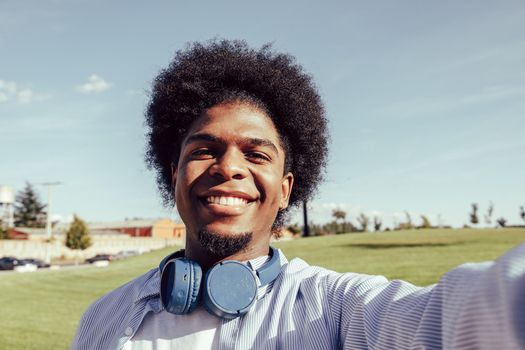 selfie of young afro man with headphones