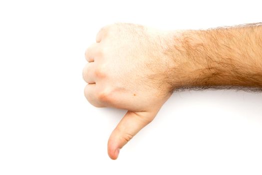 Male hairy hand showing Dislike, unlike, fail, disagree sign, thumb down hand with white background and copy space.