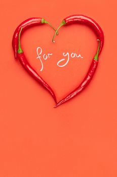 Valentine's day greeting card made of heart-shaped peppers