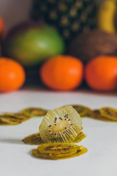 Dried homemade healthy fresh dehydrated slices of fruits. Fruit chips, natural raw vegan organic snack. Healthy food concept.