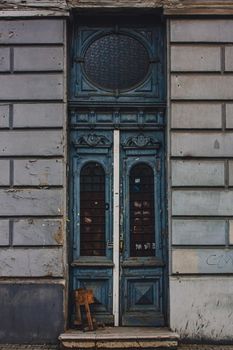 Old wooden weathered door in ancient town architecture