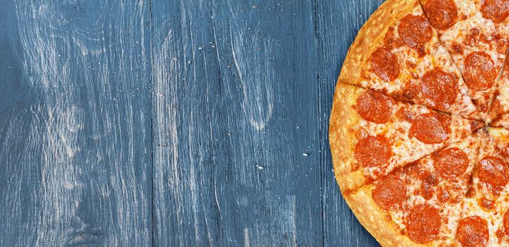 pizza close-up on a wooden surface