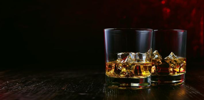 whiskey with ice in modern glasses