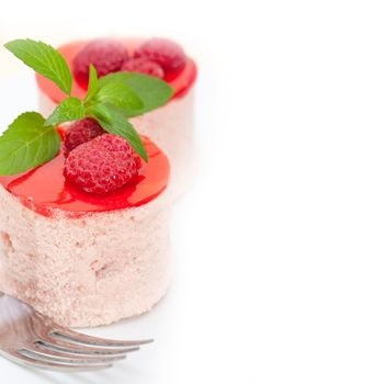 fresh raspberry cake mousse dessert round shape with mint leaves