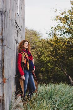 Pregnancy, maternity and happiness. Stylish young pregnant female having rest in park. Beautiful woman expecting baby, enjoying sweet moment outdoors.