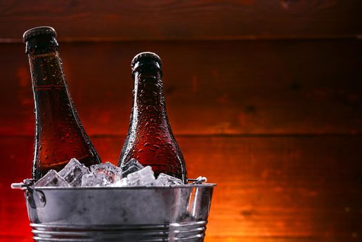 two bottles of beer in an ice bucket