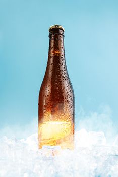 closed brown glass beer bottle on ice