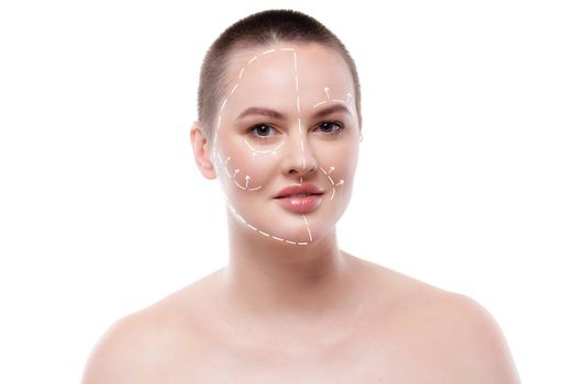 Portrait of attractive woman with arrows on her face skin for cosmetology