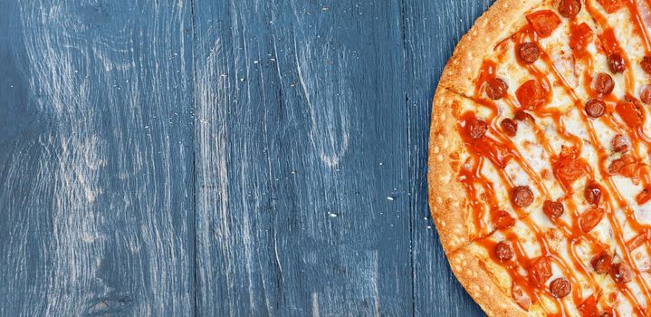 pizza close-up on a wooden surface