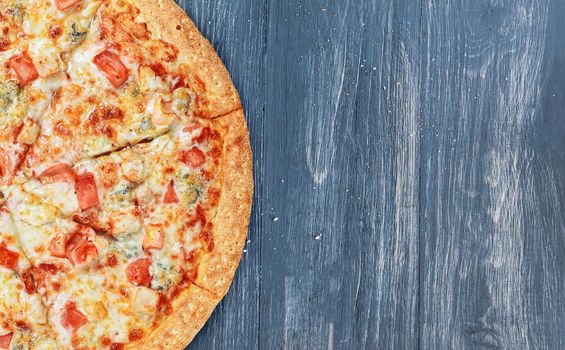 pizza close-up on a wooden surface