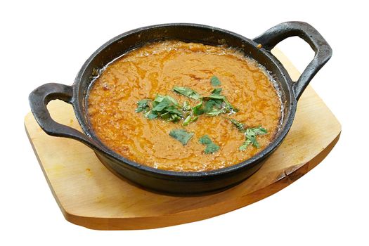 Overhead  shot of Dhal baked in little pan. Isolated on white with clipping path
