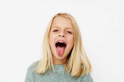 happy cute girl gestures with his hands posing studio. High quality photo