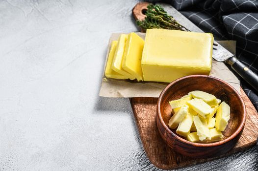 Block of fresh Butter, dairy farm products. Gray background.Top view. Copy space.