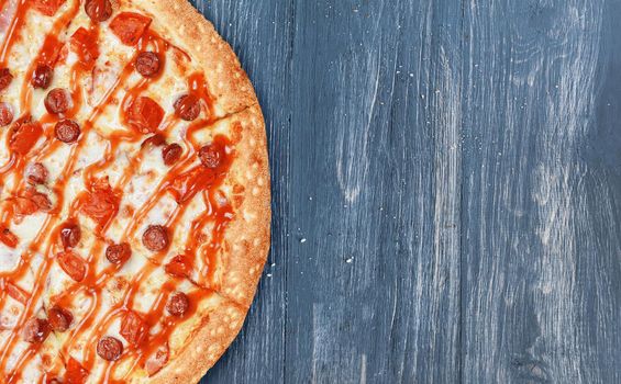 pizza close-up on a wooden surface