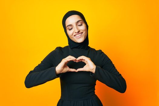 arab woman in black hijab posing fashion hand gesture studio lifestyle. High quality photo