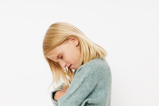 Portrait of a smiling little cutie fashionable baby clothes cropped view. High quality photo