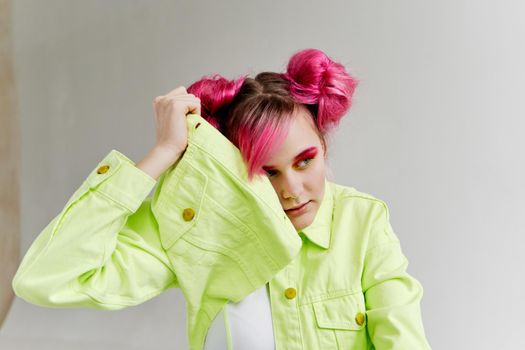glamorous woman with pink hair bright makeup posing. High quality photo
