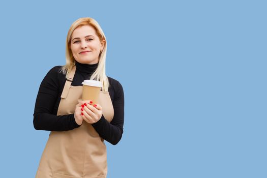 Part-time job person owner cacao routine lifestyle rest break relax leisure pause concept. Portrait of kind friendly pleasant girl giving big latte isolated on blue background copy-space.