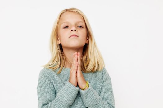 emotional girl gestures with his hands posing studio. High quality photo