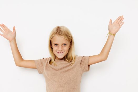 happy child gestures with his hands isolated background. High quality photo
