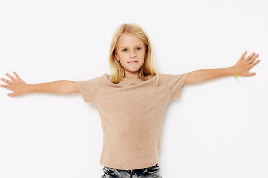 Beautiful little girl blank space for logo design posing studio. High quality photo