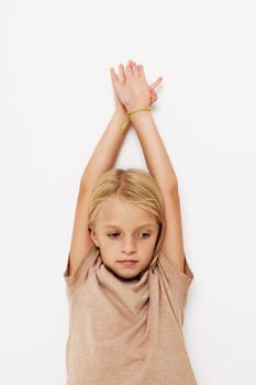 happy cute girl in a beige t-shirt isolated background. High quality photo