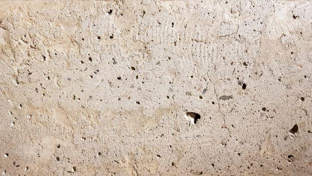 Reinforced concrete wall is useful as a background. Reinforced concrete with damaged metal fittings.