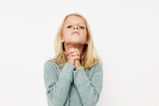 emotional girl with blond hair kids lifestyle concept. High quality photo