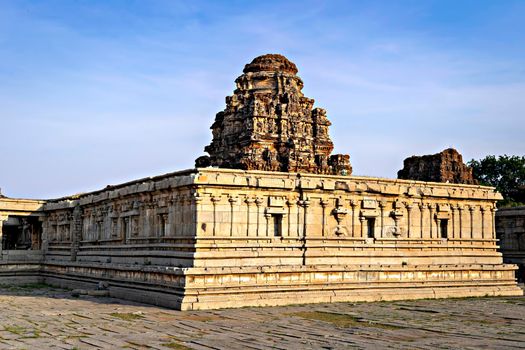 Ancient stone made Viththala temple with beautiful blue sky background in Hampi, Karnataka, India.