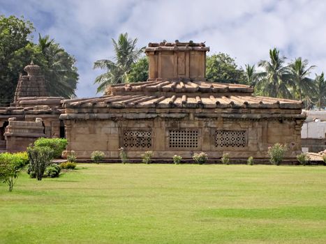 Ancient stone temple monument with blue sky background at Pattadakal , Karnataka, India.