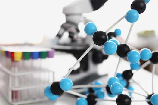 Close-up analyzing model of carbazole molecular structure in laboratory, chemical formula. Modern lab centre with equipment. Science, discovery, experiment, knowledge concept