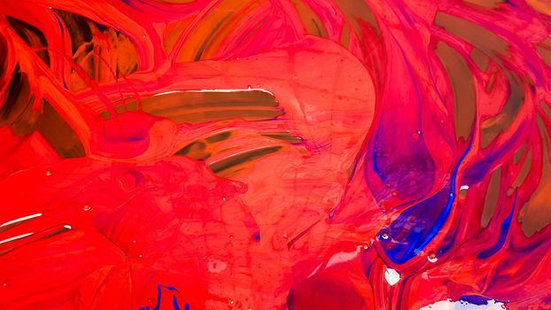 Abstract background of spilled red paint with buckets on a black backdrop. Red paint is pouring on a black background. Use it for an artist or creative concept. paints spilled red colored background.