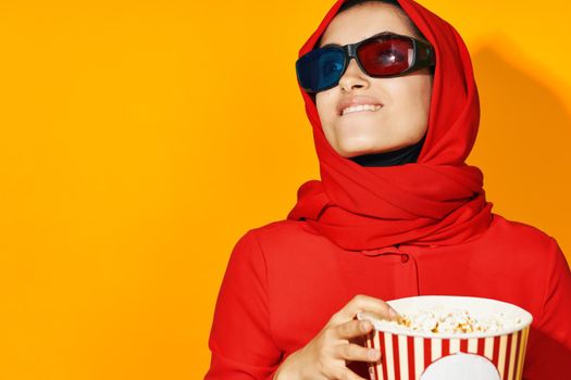 pretty woman 3d glasses technology watching movie popcorn yellow background. High quality photo