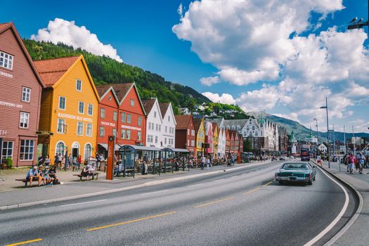 Bergen, Norway. View of historical buildings in Bryggen. Hanseatic wharf in Bergen, Norway July 28, 2019. UNESCO. Famous Bryggen street with wooden colored houses in Bergen Akerbrygge distric.