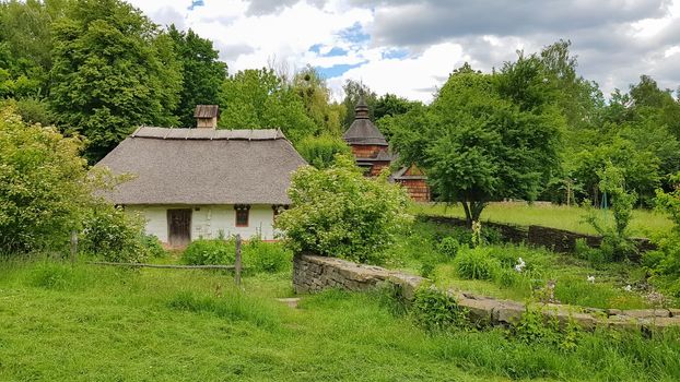 Ukraine, Kiev - June 11, 2020. The old house of peasants in the museum Pirogovo. National Museum of Folk Architecture and Everyday Life of Traditional Folklore Houses of Different Regions of Ukraine.