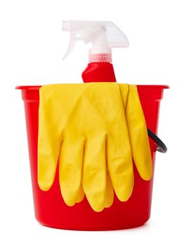 Red bucket with cleaning supplies isolated on white background, close up