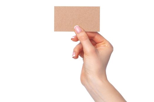 Beautiful female hand holding white business card isolated on white background