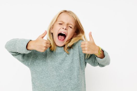 happy cute girl gestures with his hands kids lifestyle concept. High quality photo