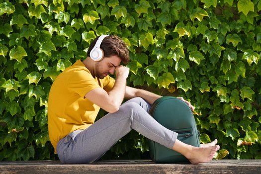 Male student sitting outside worried about his exams