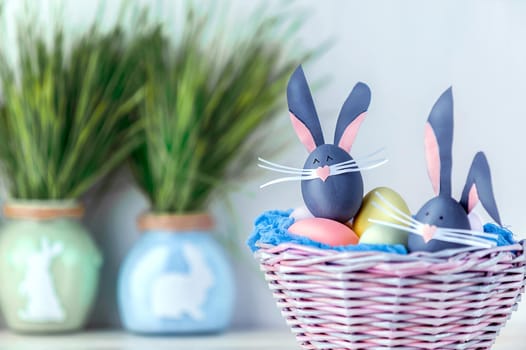 Cute creative photo with easter eggs, some eggs as the Easter Bunny