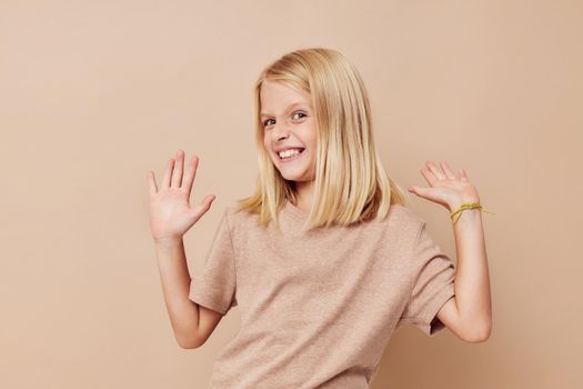 happy cute girl gestures with his hands isolated background. High quality photo