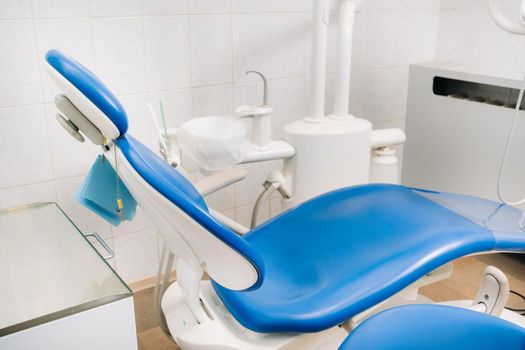 An empty chair in the dentist's office. Empty dentist's office.