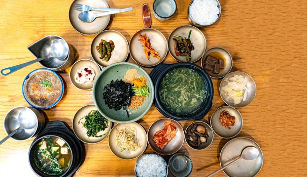 Korean style dishes of soup and pickled vegetables