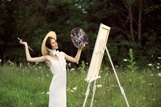 cheerful woman outdoors drawing art landscape hobby. High quality photo