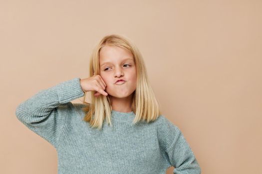 Little cute girl with blond hair cropped view. High quality photo